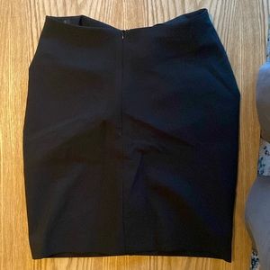 Black mini skirt with side rushing